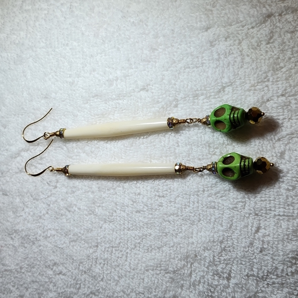 Long green scull and bone earrings